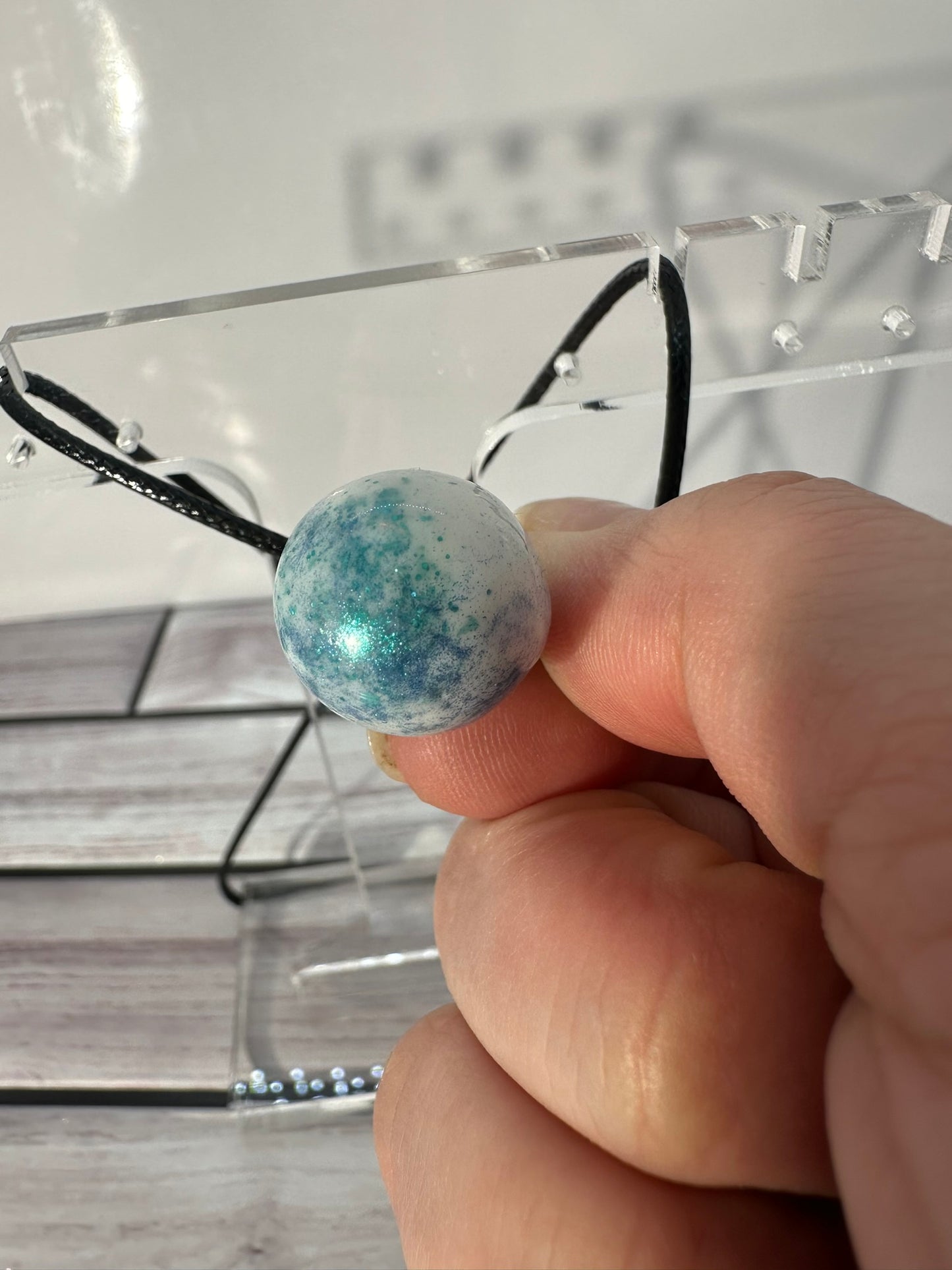 White Egg with Blue and Green Speckles Pendant Necklace