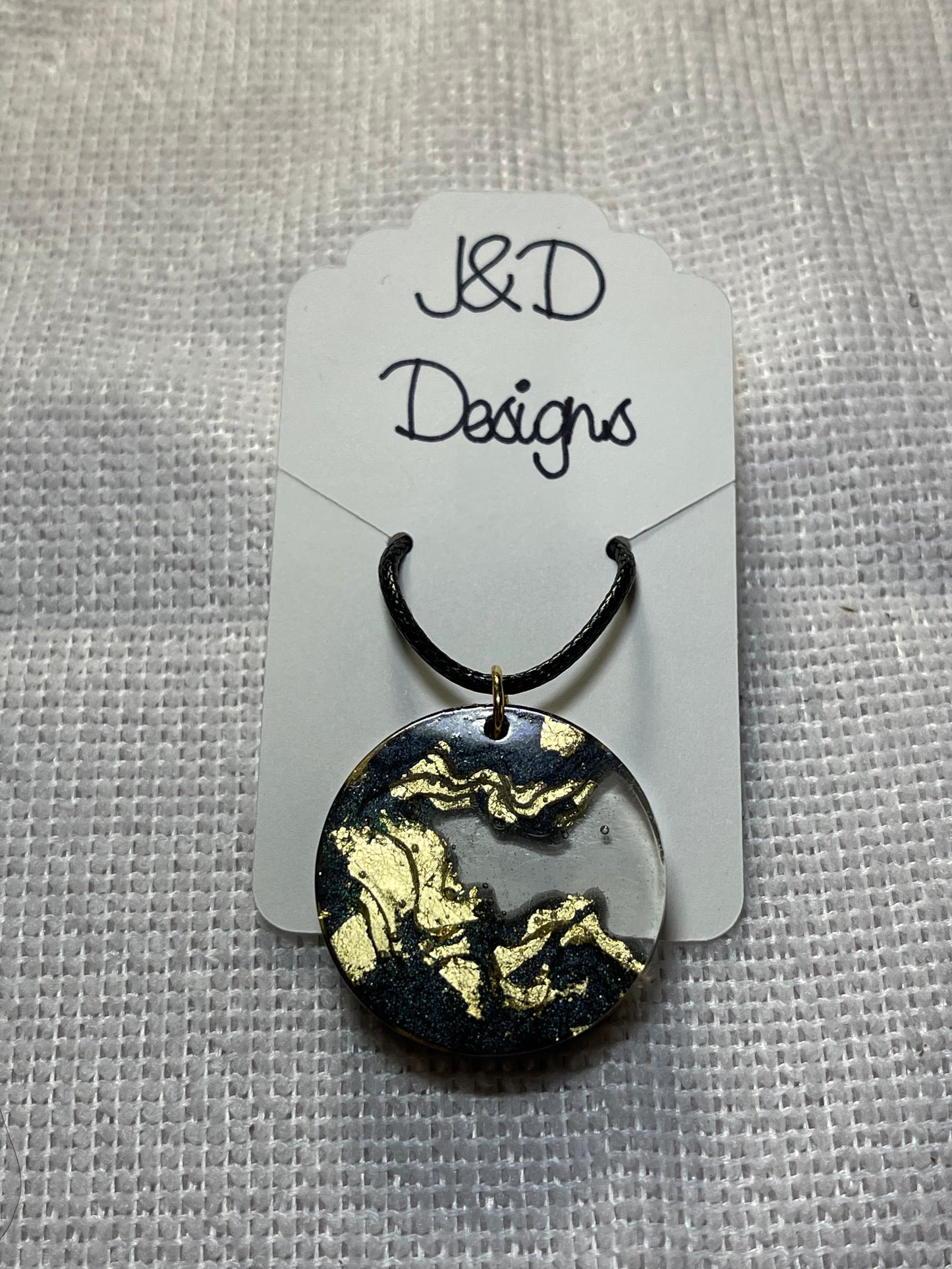 Land and Water Black and Gold Flake Round Resin Pendant Necklace