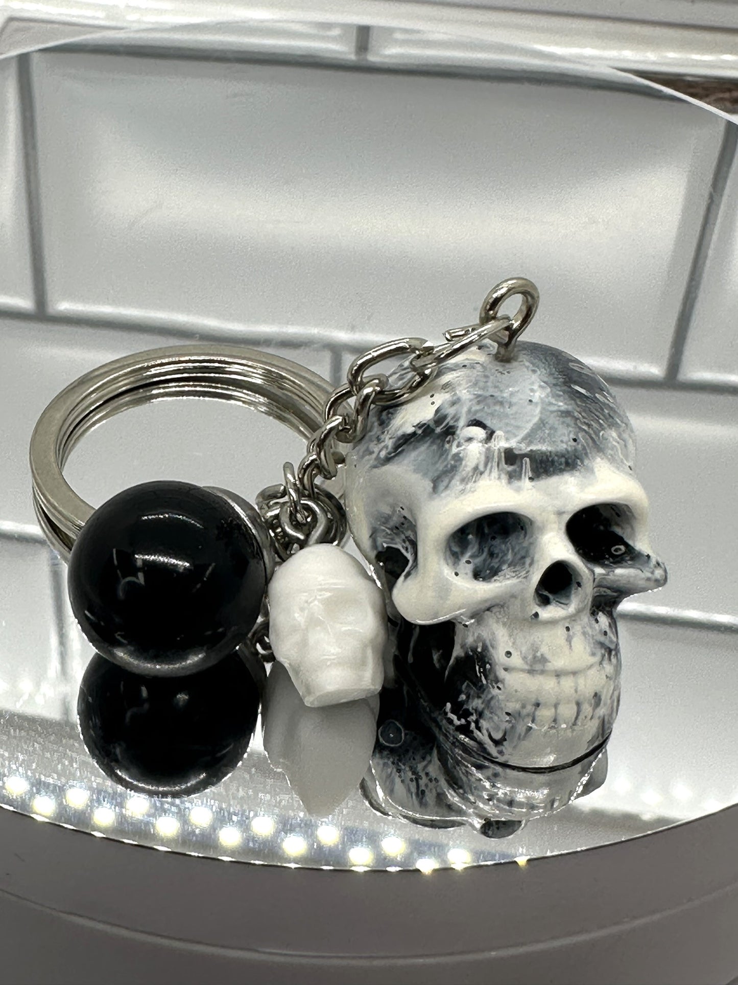 Black and White Swirl Skull Keychain with Black Sphere and White Mini Skull