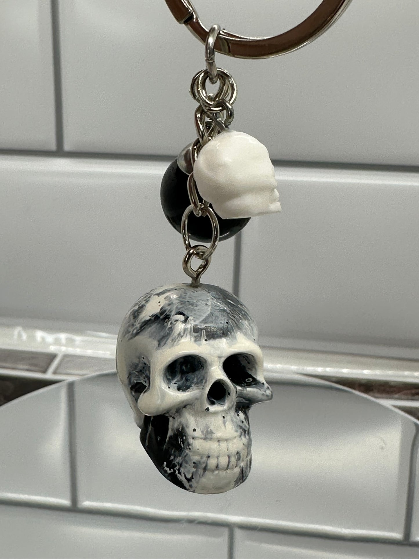 Black and White Swirl Skull Keychain with Black Sphere and White Mini Skull