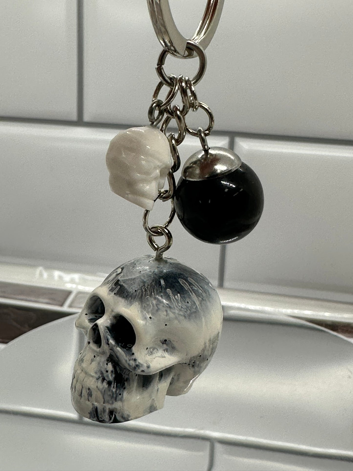 Black and White Swirl Skull Keychain with Black Sphere and White Mini Skull