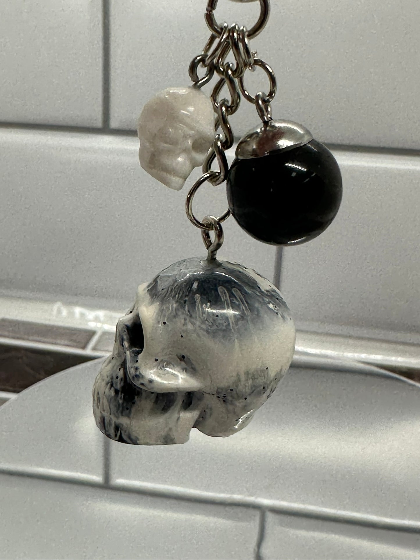 Black and White Swirl Skull Keychain with Black Sphere and White Mini Skull