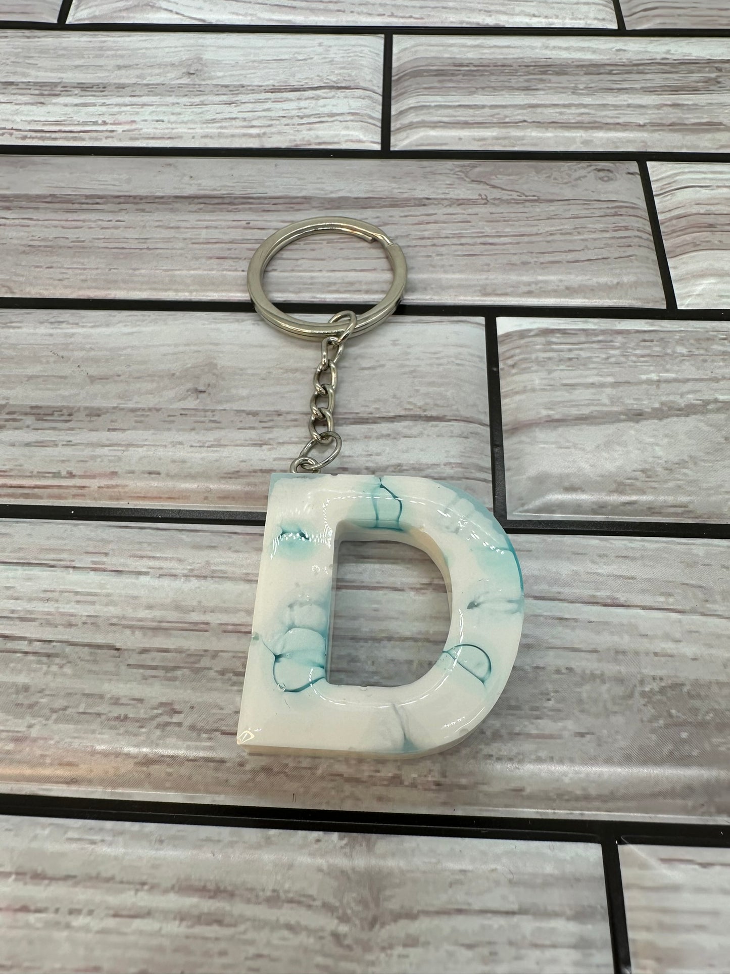 Light Blue Swirled Resin Letter D Keychain