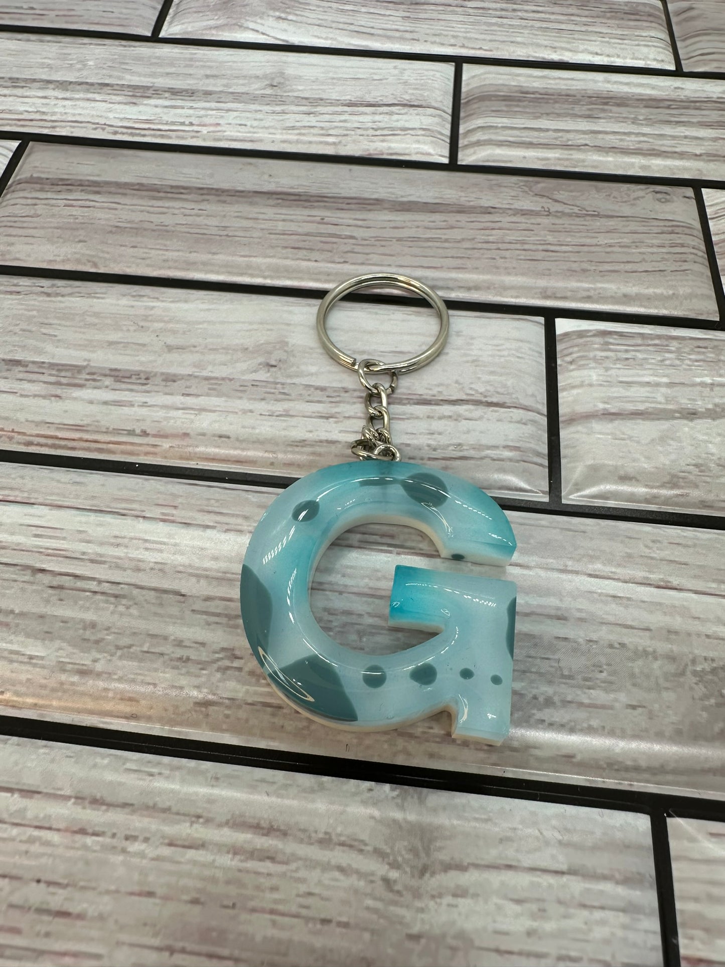 Blue and White Swirled Resin Letter G Keychain