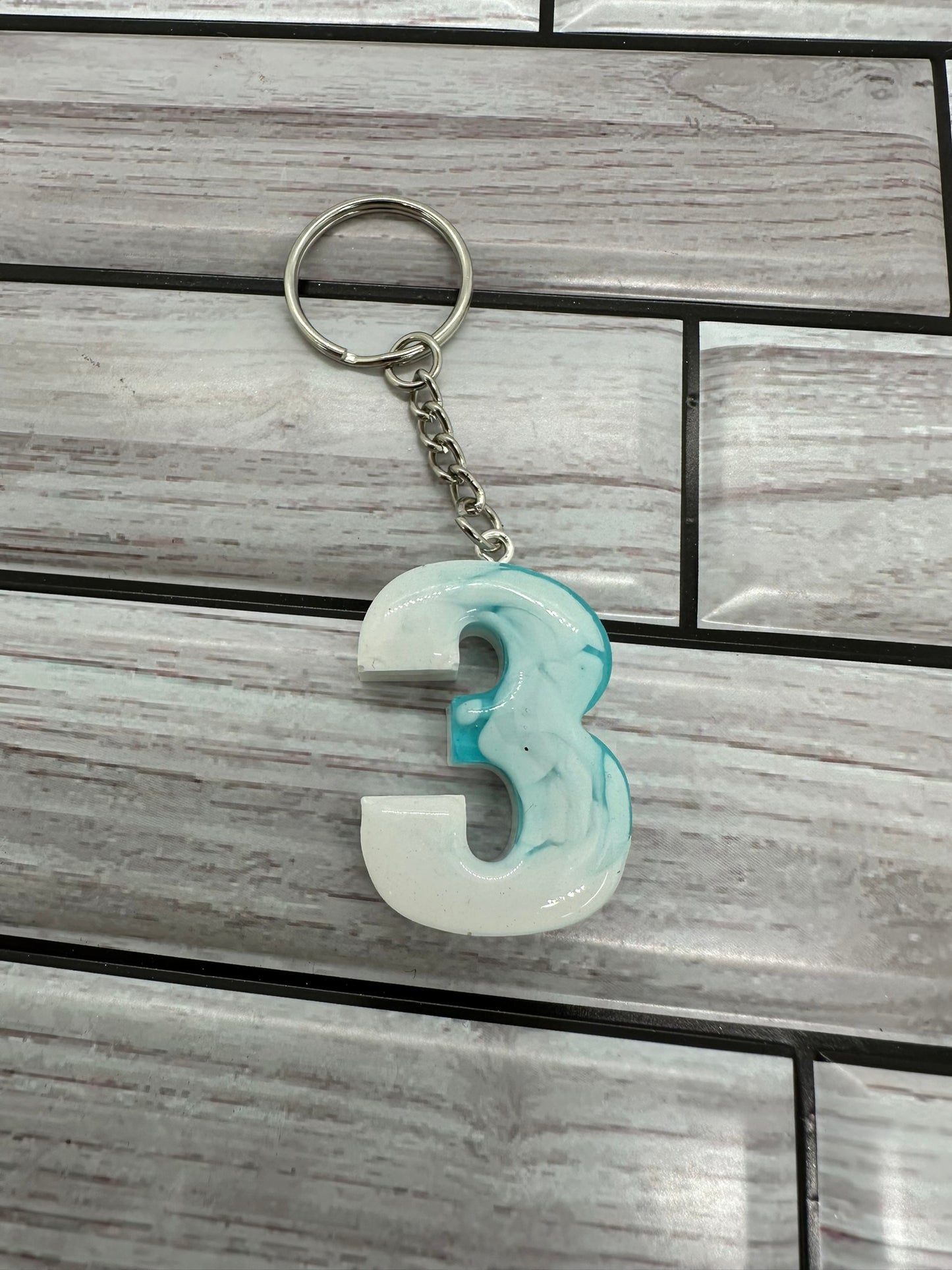 White and Blue Swirls Resin Number 3 Keychain