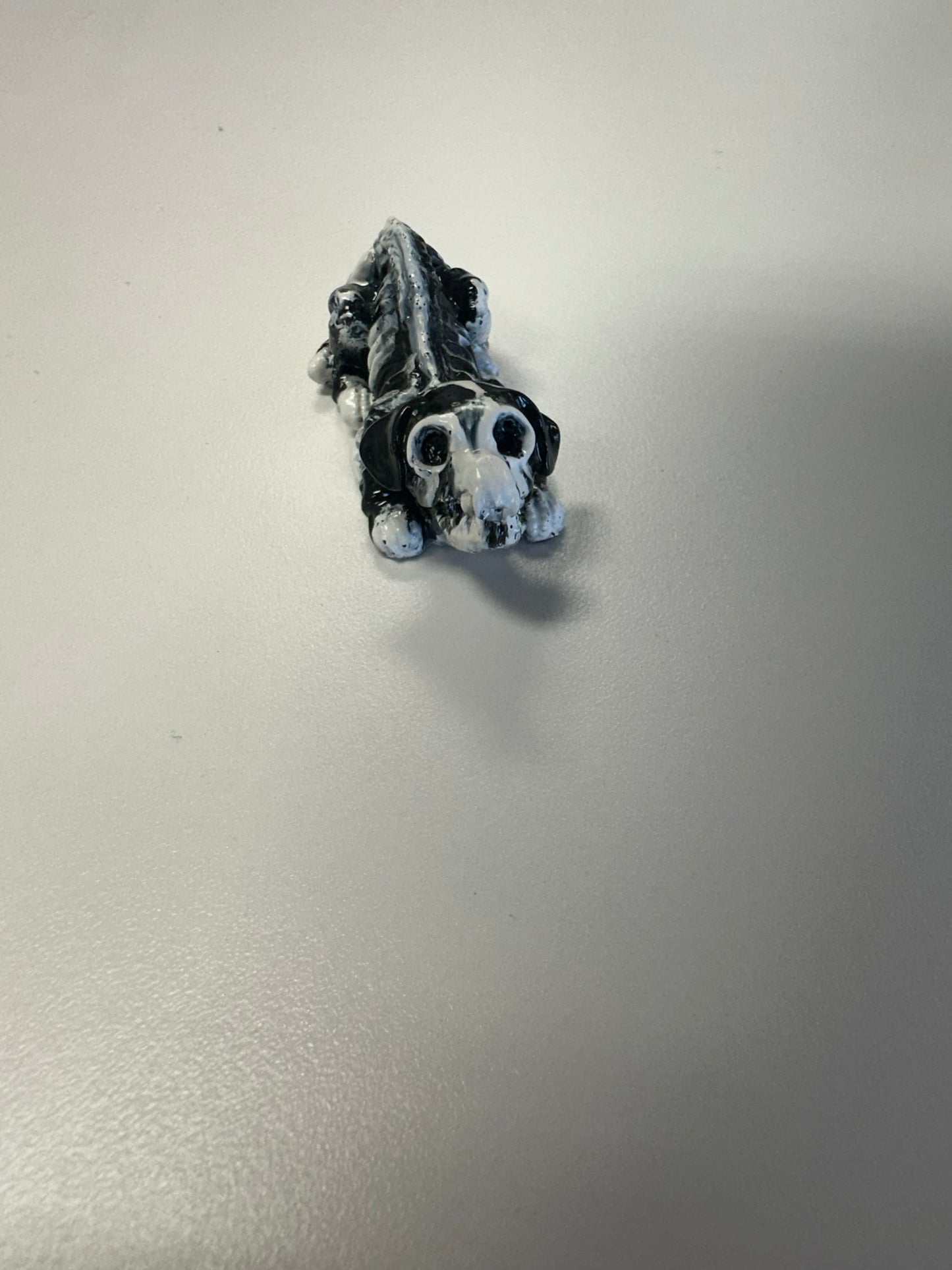 Marbled Madness: Black and White Skull Dog Figurine