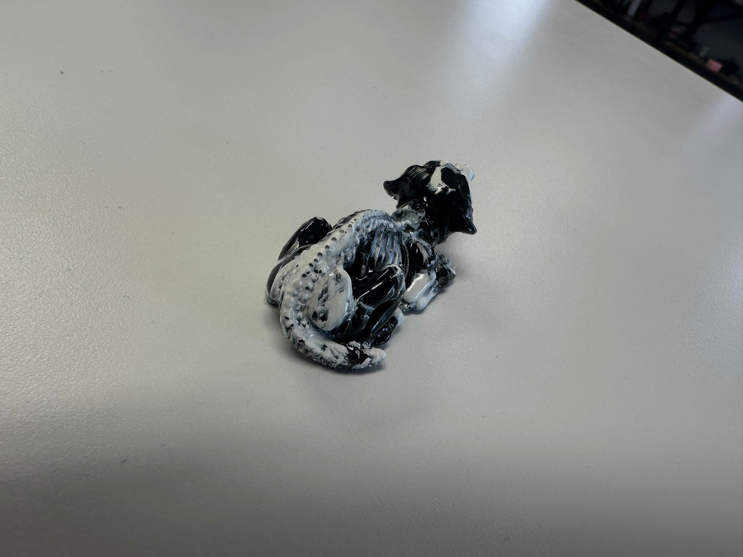 Marbled Madness: Black and White Skull Dog Figurine